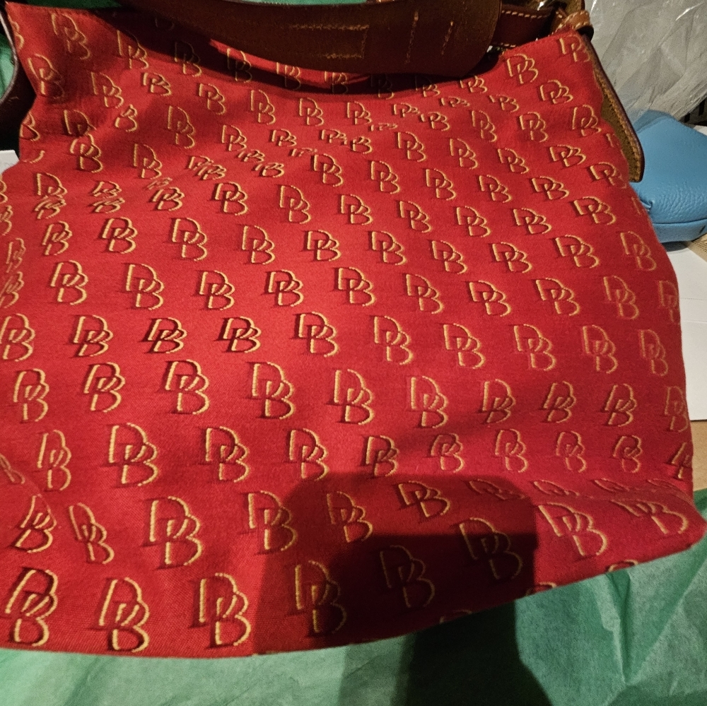 NWT Dooney & Bourke Shoulder Bag.  Strap is Leather with Woven Material for bag.